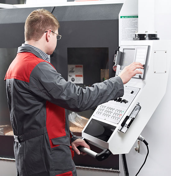 Tychon CNC machine operator at work